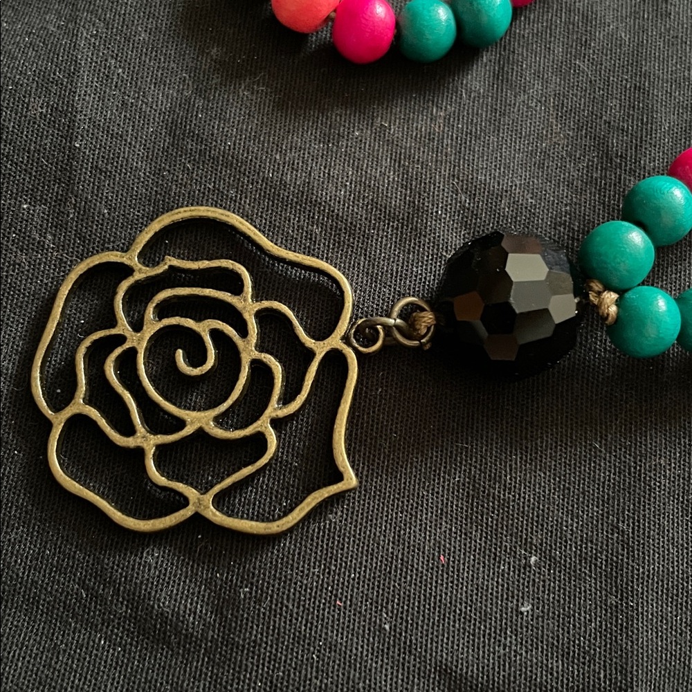 Hand assembled beaded necklace brass rose